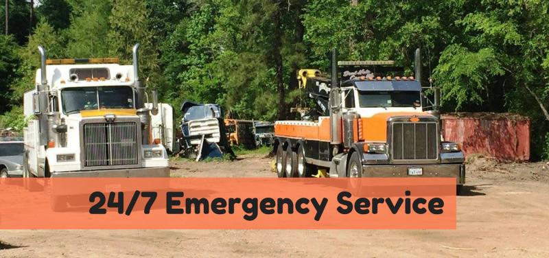 White and orange service trucks in parking lot - 24/7 service